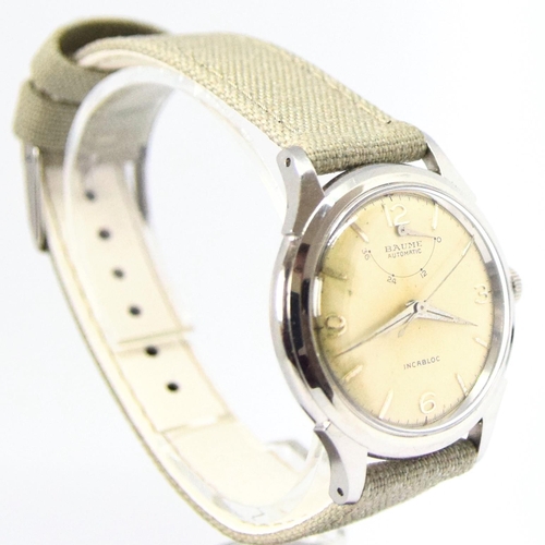 174 - BAUME SWISS POWER RESERVE AUTOMATIC WRISTWATCH WITH ARABIC NUMERALS CIRCA 1950s. AUTOMATIC CAL, stai... 