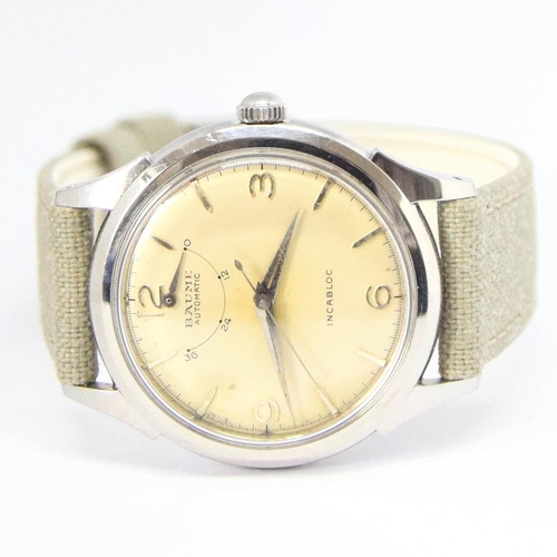 174 - BAUME SWISS POWER RESERVE AUTOMATIC WRISTWATCH WITH ARABIC NUMERALS CIRCA 1950s. AUTOMATIC CAL, stai... 