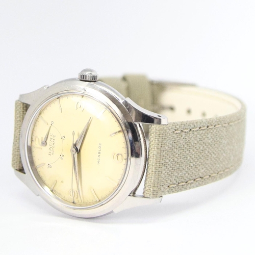 174 - BAUME SWISS POWER RESERVE AUTOMATIC WRISTWATCH WITH ARABIC NUMERALS CIRCA 1950s. AUTOMATIC CAL, stai... 