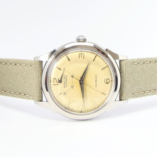 174 - BAUME SWISS POWER RESERVE AUTOMATIC WRISTWATCH WITH ARABIC NUMERALS CIRCA 1950s. AUTOMATIC CAL, stai... 