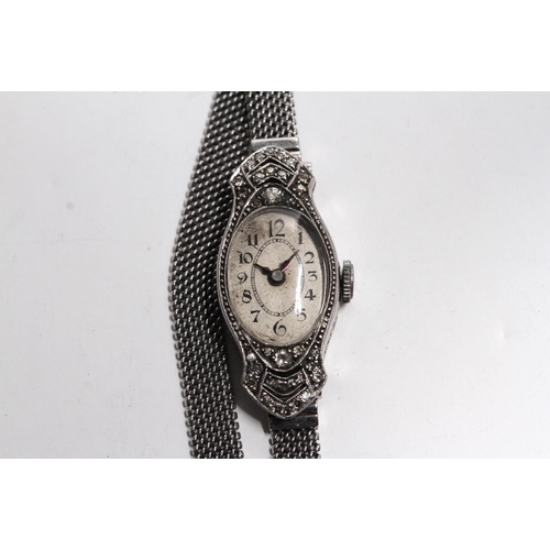 323 - VINTAGE PLATINUM DIAMOND CASE LADIES WATCH, oval patina dial with arabic numeral hour markers, 13.5m... 