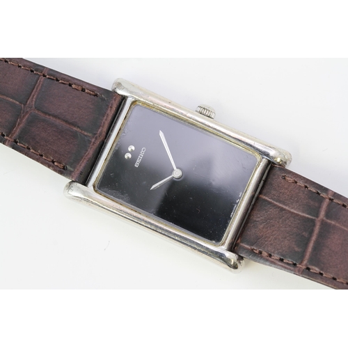 63 - SEIKO 885 SILVER MANUAL WIND WRISTWATCH, rectangular black dial, 885 silver case, brown Seiko leathe... 