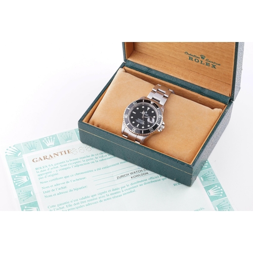 79 - ROLEX OYSTER PERPETUAL DATE SUBMARINER W/ BOX & GUARANTEE PAPERS REF. 16610 CIRCA 2002, circular bla... 