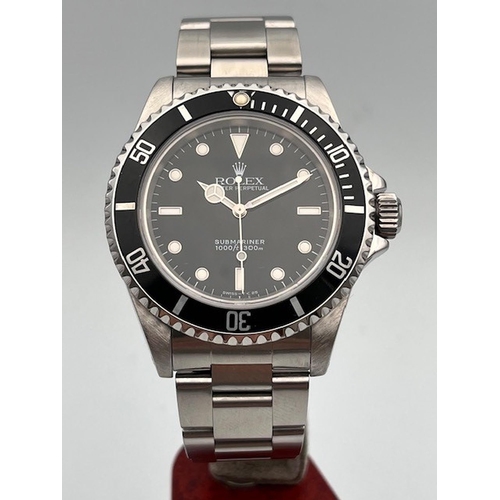 40 - ROLEX SUBMARINER NO DATE 14060 WITH BOX AND PAPERS 1998, Black dial with applied baton and dot hour ... 