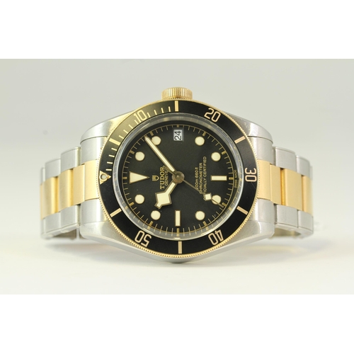 57 - TUDOR BLACK BAY 41 STEEL AND GOLD REFERENCE 79733N, circular black dial with applied hour markers, s... 