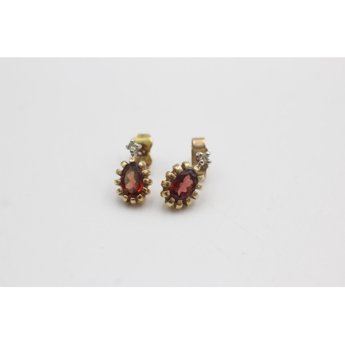 1066 - 9ct gold garnet & diamond stud earrings (1.8g)