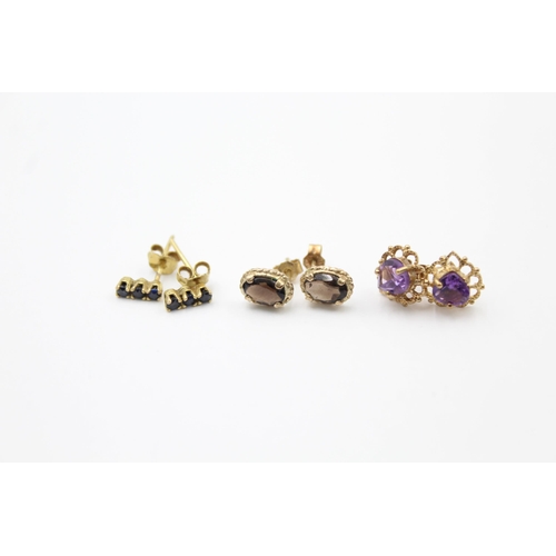 1075 - 3 x 9ct gold paired gemstone stud earrings inc. sapphire, amethyst & smoky quartz (2.1g)