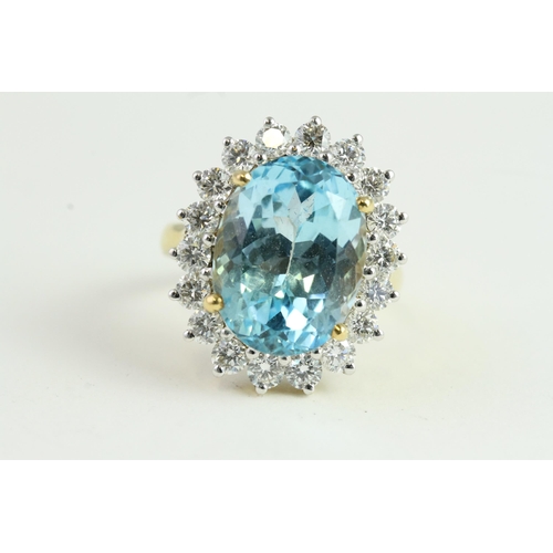 1514 - 18YG Blue Topaz and Diamond Oval Cluster Ring. BlueT 14.28ct & D1.80ct