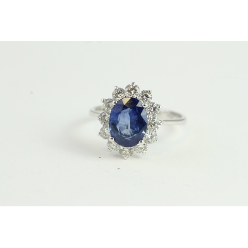 1515 - 18WG Oval Sapphire and Diamond Cluster Ring. S2.54ct & D0.99ct