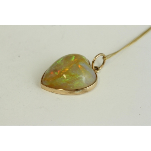 1108 - Victorian antique gold natural opal carved heart pendant necklace. Hung on a modern chain. The penda... 