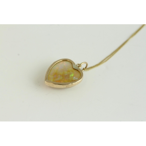 1108 - Victorian antique gold natural opal carved heart pendant necklace. Hung on a modern chain. The penda... 