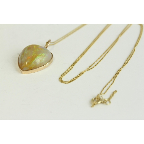 1108 - Victorian antique gold natural opal carved heart pendant necklace. Hung on a modern chain. The penda... 