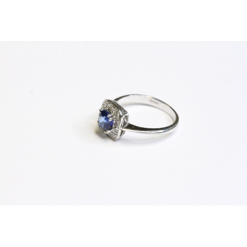 1538 - 18CT WHITE GOLD SAPPHIRE AND DIAMOND CLUSTER RING, sapphire weight 1.16ct. UK size M. Total weight 3... 