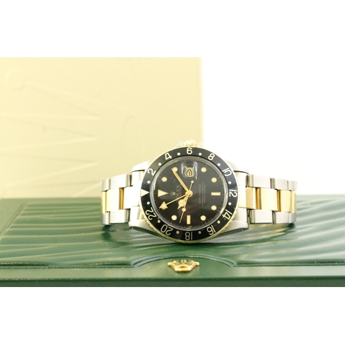 24 - VINTAGE ROLEX GMT MASTER 16753 STEEL AND GOLD CIRCA 1982, circular gloss black dial with mercedes ha... 