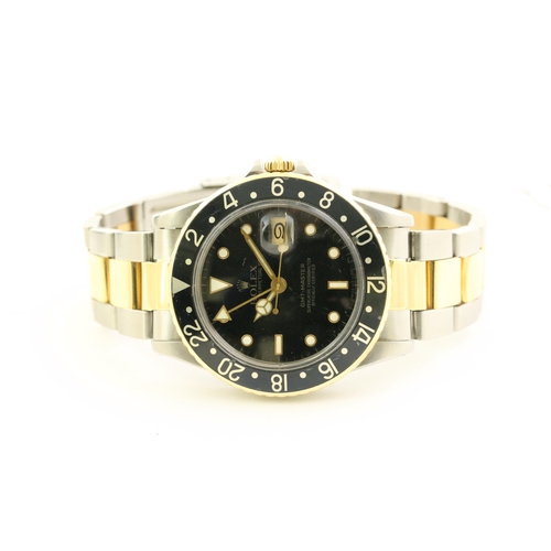 24 - VINTAGE ROLEX GMT MASTER 16753 STEEL AND GOLD CIRCA 1982, circular gloss black dial with mercedes ha... 