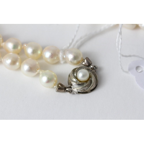 1001 - Vintage Silver and Cultured Baroque Tapered Pearl NecklaceSet with a Silver clasp marked 835. The ne... 