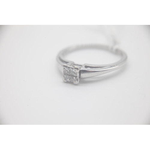 1003 - Fine 18ct White Gold 25pt Diamond RingSet with four Princess Cut Diamonds totalling 25pts. UK Size P... 