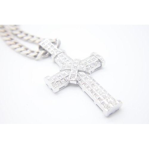 1007 - Fine 14ct White Gold Diamond Set Cross
Hanging on a Silver curb chain. The cross measures 8cm x 4.5c... 