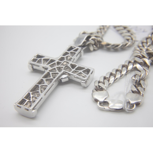 1007 - Fine 14ct White Gold Diamond Set Cross
Hanging on a Silver curb chain. The cross measures 8cm x 4.5c... 