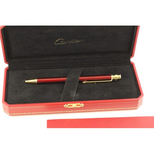 1023 - CARTIER BALLPOINT WITH BOX AND PAPERS, red lacquer case, gold detail, with Cartier box and paperwork... 