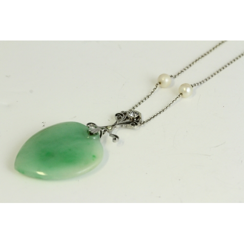 1029 - Art Deco white gold diamond and jade heart pendant necklace. Set in white gold with two cultured pea... 