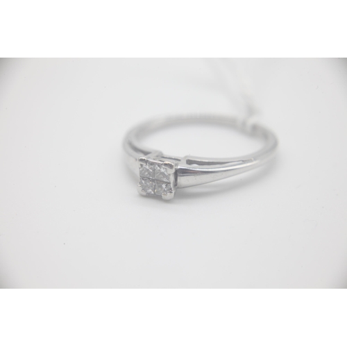 1003 - Fine 18ct White Gold 25pt Diamond RingSet with four Princess Cut Diamonds totalling 25pts. UK Size P... 