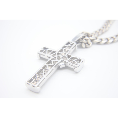 1007 - Fine 14ct White Gold Diamond Set Cross
Hanging on a Silver curb chain. The cross measures 8cm x 4.5c... 