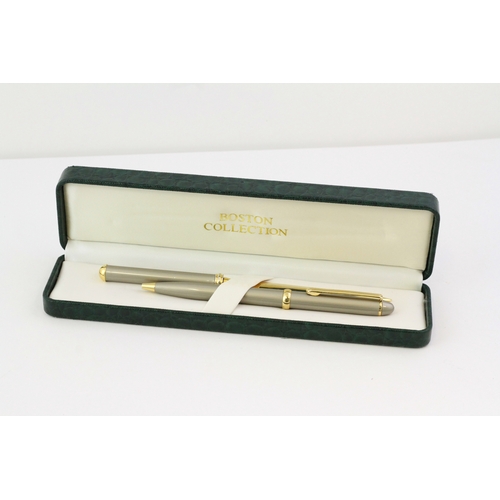 1024 - BOSTON PEN AND LETTER OPENER SET, brushed steel case and handle, gold plated detail and blade,