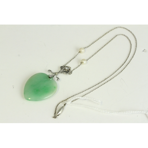 1029 - Art Deco white gold diamond and jade heart pendant necklace. Set in white gold with two cultured pea... 