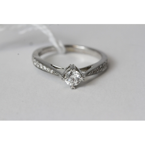 1031 - Fine 9ct White Gold 50pt Diamond Solitaire RingMarked 0.50 for 50pts as well as a full 9ct Gold Lond... 