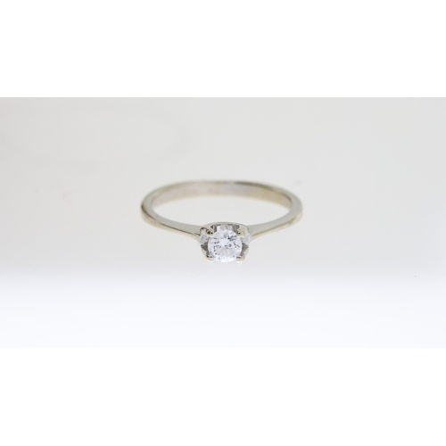 1284 - Fine 18ct white gold and 25 point estimated diamond solitaire ring. The diamond is a VVS1 stone with... 