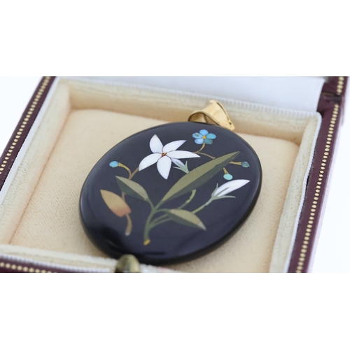 1285 - Antique gold pietra dura pendant set with a yellow gold bale . The pendant measures 6cm x 3.5cm wide... 