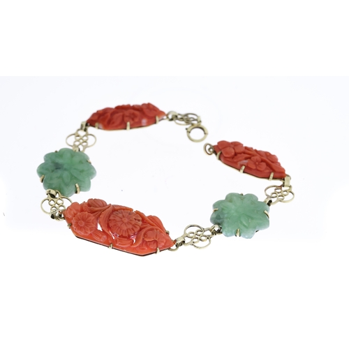 1295 - EARLY 20TH CENTURY CORAL AND JADE CARVED PANEL BRACELET, central carved coral floral plaque, approx ... 