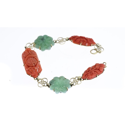 1295 - EARLY 20TH CENTURY CORAL AND JADE CARVED PANEL BRACELET, central carved coral floral plaque, approx ... 