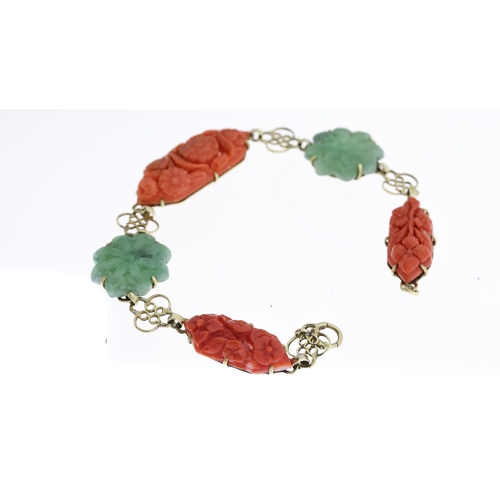 1295 - EARLY 20TH CENTURY CORAL AND JADE CARVED PANEL BRACELET, central carved coral floral plaque, approx ... 