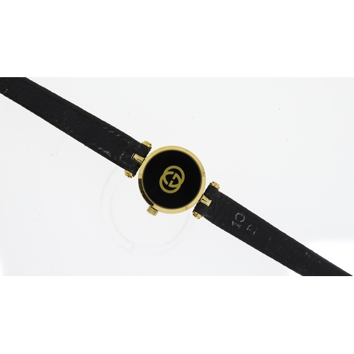 98 - LADIES GUCCI QUARTZ WRISTWATCH, circular black dial with roman numeral hour markers, 22mm gold plate... 