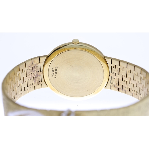 14 - 18CT PIAGET AUTOMATIC WITH BOX REFERENCE 12601, circular champagne bark effect dial with baton hour ... 