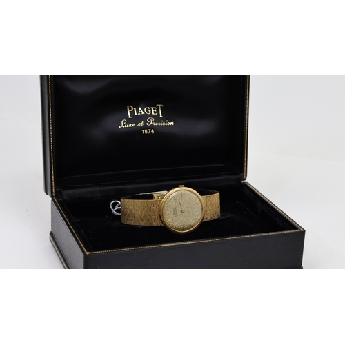 14 - 18CT PIAGET AUTOMATIC WITH BOX REFERENCE 12601, circular champagne bark effect dial with baton hour ... 