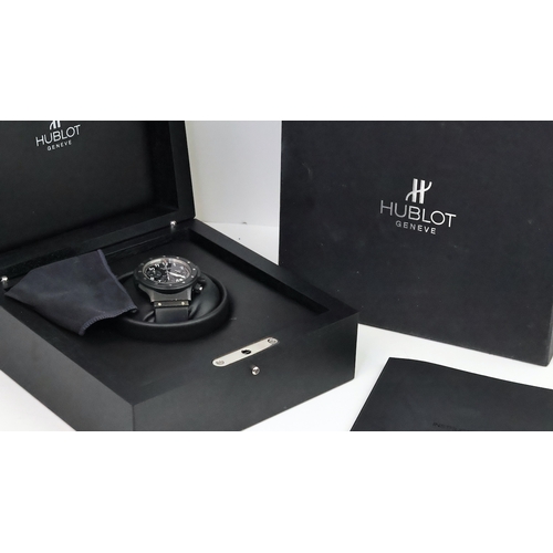 36 - HUBLOT SUPER B BLACK MAGIC FLYBACK CHRONOGRAPH WITH BOX REFERENCE B 1926.12, circular gloss black di... 