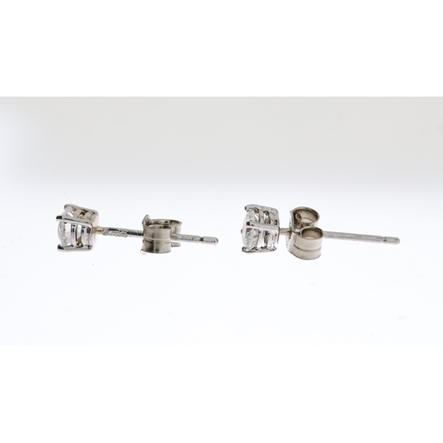 1029 - 18CT WHITE GOLD DIAMOND STUD EARRINGS APPROX 0.5CT, overall reasonable clarity, hallmarked 750 with ... 