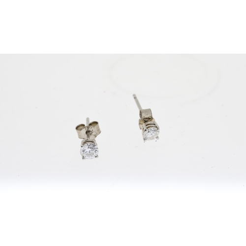 1029 - 18CT WHITE GOLD DIAMOND STUD EARRINGS APPROX 0.5CT, overall reasonable clarity, hallmarked 750 with ... 