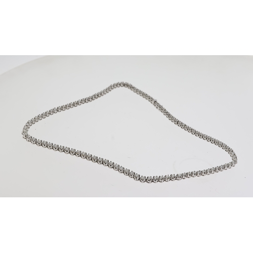 1005 - Fine 18ct gold designer KOJIS diamond necklace. Set in white gold with an estimated 8 carats of diam... 