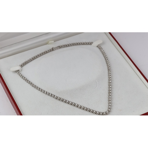 1005 - Fine 18ct gold designer KOJIS diamond necklace. Set in white gold with an estimated 8 carats of diam... 