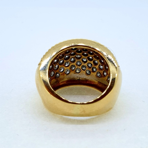 1015 - A yellow gold pave set diamond bombe ring. Marked 18K
and 750 Diamond weight estimated at 2.50 carat... 