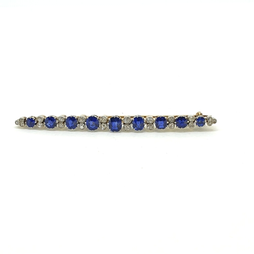 1017 - An Antique brooch pin comprising 9 graduating sapphires
separated by 22 old cut diamonds. Length 7cm