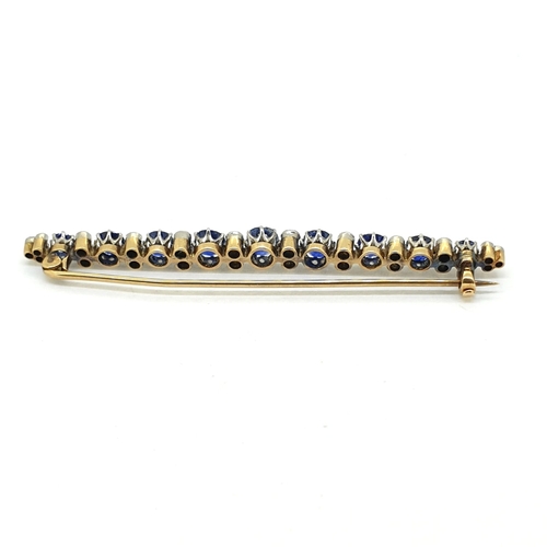 1017 - An Antique brooch pin comprising 9 graduating sapphires
separated by 22 old cut diamonds. Length 7cm