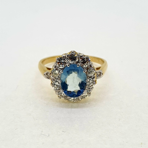 1018 - Oval aquamarine and diamond crown cluster ring with a
diamond set at the shoulder. Aquamarine 0.80 c... 