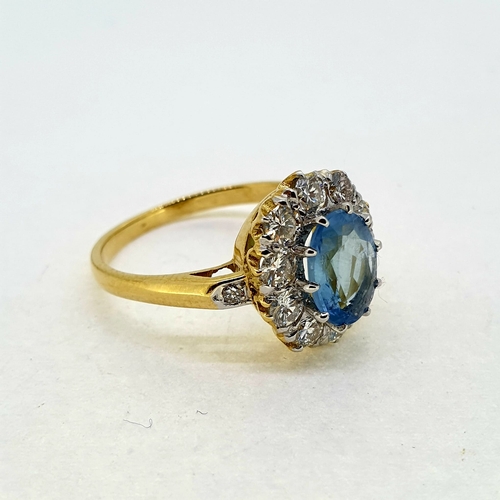 1018 - Oval aquamarine and diamond crown cluster ring with a
diamond set at the shoulder. Aquamarine 0.80 c... 