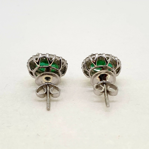 1019 - Oval emerald and diamond cluster earrings Emeralds
2.21carats
Diamonds 0.68 carats
18 carat white go... 