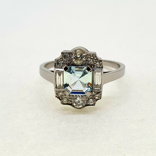 1027 - Aquamarine and diamond tablet ring with prominent
baguette diamonds. Aquamarine 0.80 carats Diamond
... 